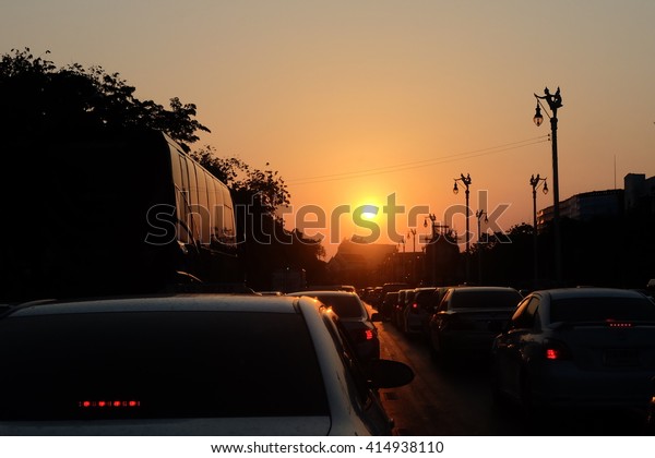Traffic Jam with\
Sunset on road in\
Thailand