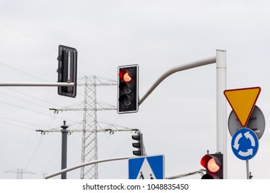 A traffic light at a busy intersection