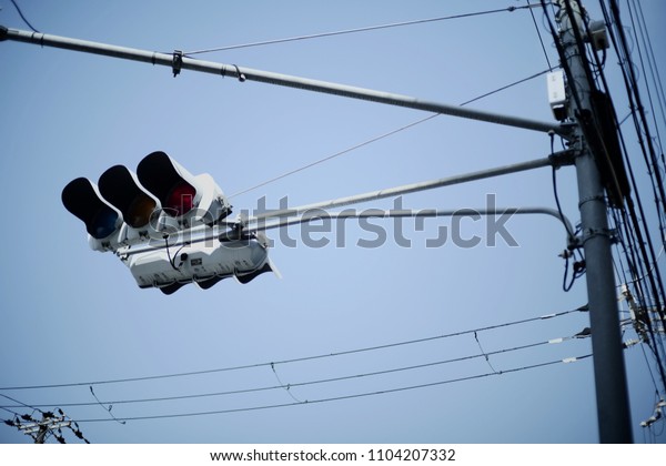 Traffic light and\
electric pole in\
Bangkok.