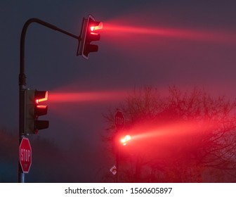 Traffic Light In Foggy Night