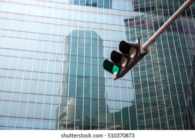 Traffic Light ,green Light, With Building Background In Downtown Singapore