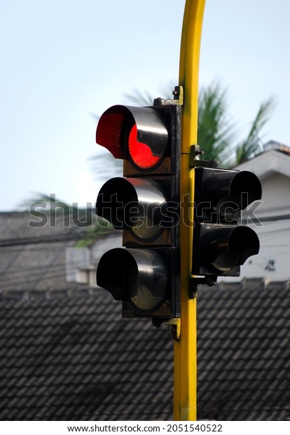 traffic light is lit red stop\
sign