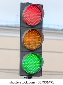 Traffic Light. Multiple Exposure. At The Same Time To See All The Lights Of The Traffic Light, Red, Yellow And Green.