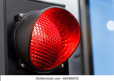 The traffic light is on in red.