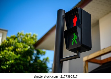 Traffic light for pedestrians on blue sky background outdoors