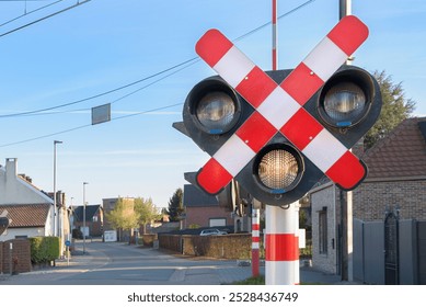 Traffic light for the railroad. The path is clear for the movement of cars with a yellow signal at the crossing. - Powered by Shutterstock