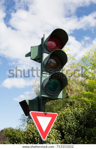 Traffic light\
with red color on blue sky\
background