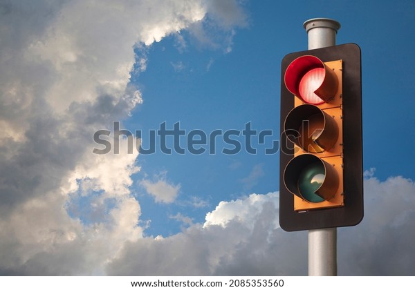 Traffic Light, Red Light,\
Stormy Sky