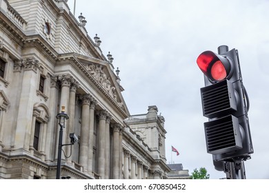 Traffic Light Signal In Red Light With An Old Building At The Left.London, England, UK