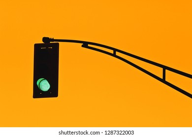 Traffic light silhouette and golden sky. - Powered by Shutterstock