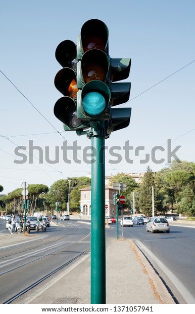 Traffic light standing on the\
road