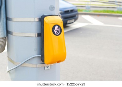 Traffic light switch button at a pedestrian crossing. You need to put your hand to the device to go.