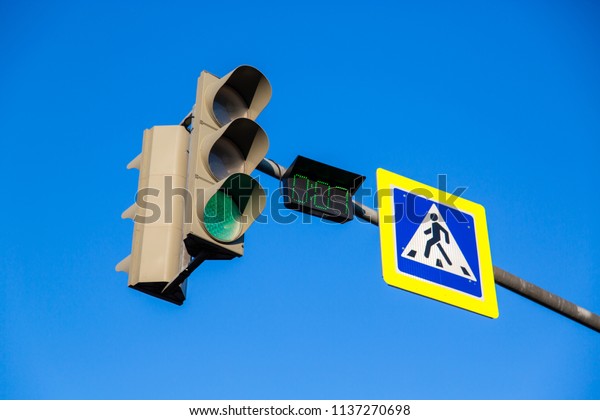 Traffic light with a\
timer at the crossroads