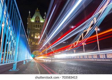 Traffic light trails along Tower Bridge in London. UK