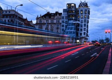 Traffic light trails in front of the Dancing House - Prague, the capital of the Czech Republic