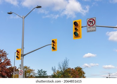 Traffic lights against blue sky on road of Ottawa city in Canada in fall season on sunny day
