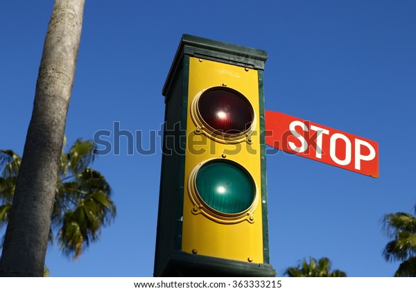 Traffic lights - green and red. Traffic lights with\
the stop sign.