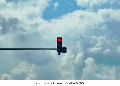 Traffic lights isolated on cloudy blue sky background
