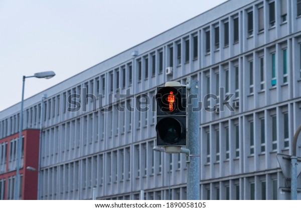 Traffic lights with the\
red light lit.