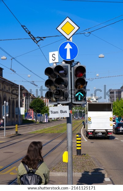 Traffic\
lights and traffic signs at City of Basel on a sunny spring day.\
Photo taken May 11th, 2022, Basel,\
Switzerland.