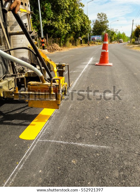 Traffic line painting .\
Road Vehicles.