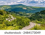 Traffic moving along a busy dual carriageway in South Wales (A465 Heads of the Valleys)