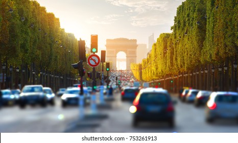 Traffic On Champs Elysee And View Of Arc De Triomphe In Paris, France