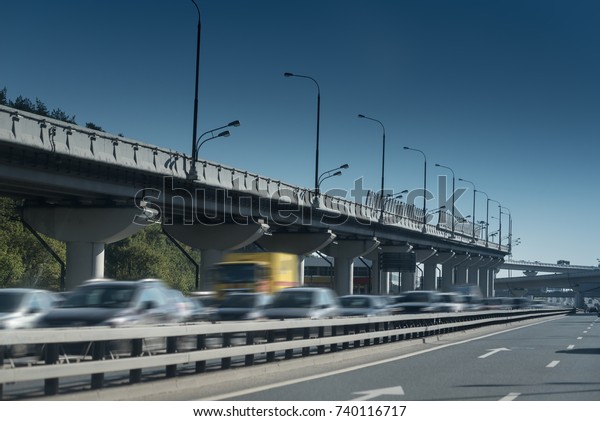 traffic on express way with viaduct, cars with high\
speed toward to city