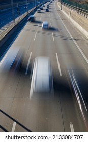 traffic on a German autobahn. View from a bridge to the roadway with motion blurred vehicles. 