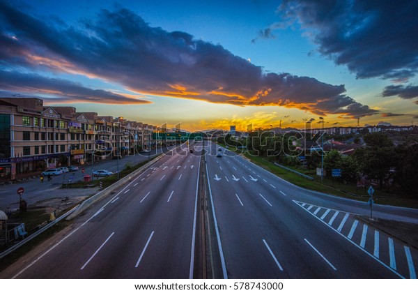 Traffic on highway\
at dusk - high angle\
view