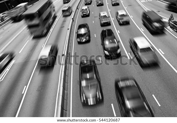 Traffic on multiple lane highway with motion blur\
(Black and White)