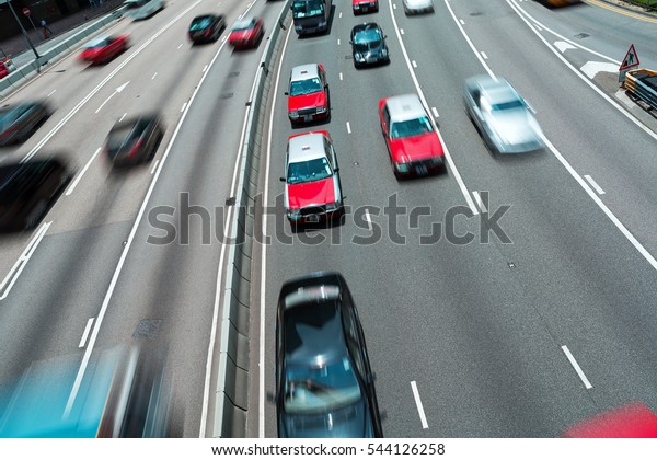 Traffic on\
multiple lane highway with motion\
blur