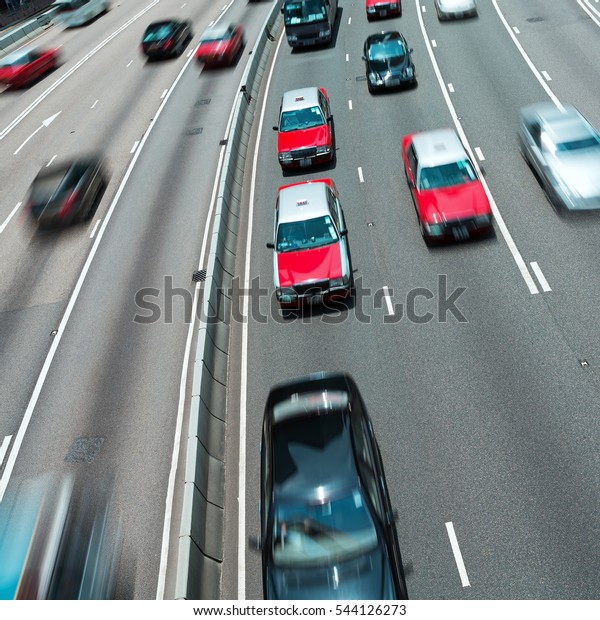 Traffic on\
multiple lane highway with motion\
blur