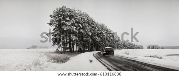 Traffic\
on the road in bad weather conditions in\
winter.