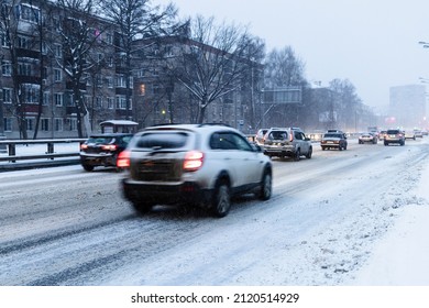 Traffic On Slippery Snowy City Road In Blue Winter Dusk In Moscow City