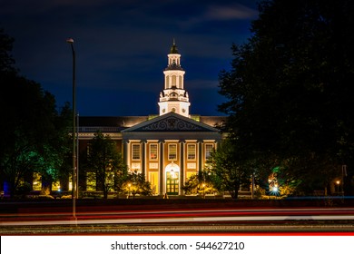 Traffic On Soldiers Field Road And Building At Harvard Business School At Night, In Boston, Massachusetts.