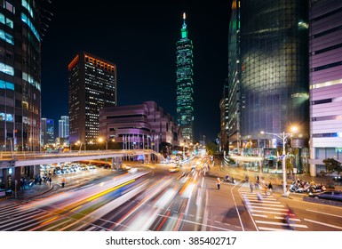 Traffic On Xinyi Road And View Of Taipei At Night, In Taipei, Taiwan.