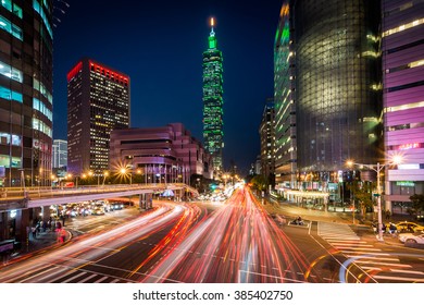 Traffic On Xinyi Road And View Of Taipei At Night, In Taipei, Taiwan.