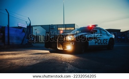 Traffic Patrol Car in Pursuit. Police Officers in Squad Car Chasing Suspect on Industrial Road, Sirens Blazing, High Speed. Cops on Emergency Response Call. Stylish Cinematic Action