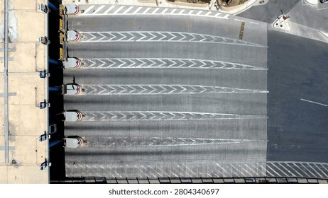 Traffic patterns of vehicles moving through toll booth lanes captured from above