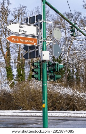Traffic post with  direction signs indicating directions to Golm, Eiche and Sanssouci Park . Postdam, Belin-Branderburg