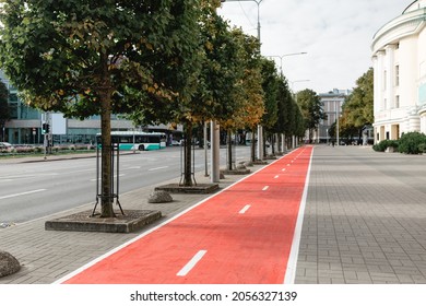 Traffic, Road Marking And City Concept - Bike Lane Or Red Road For Bicycles On Street In Tallinn, Estonia