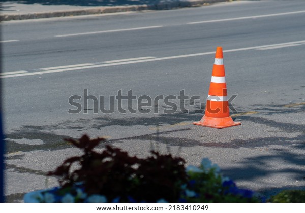 Traffic road safety\
background orange cone street work car asphalt, concept warning\
plastic for caution for security equipment, maintenance bright.\
Concrete copy dividing,