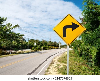 Traffic road sign turn right on empty highway without cars in Dominican Republic, nobody