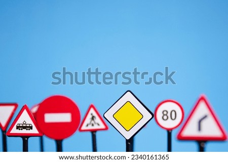 traffic rules and guidelines for drivers, driving safety and education, road signs on a blue background