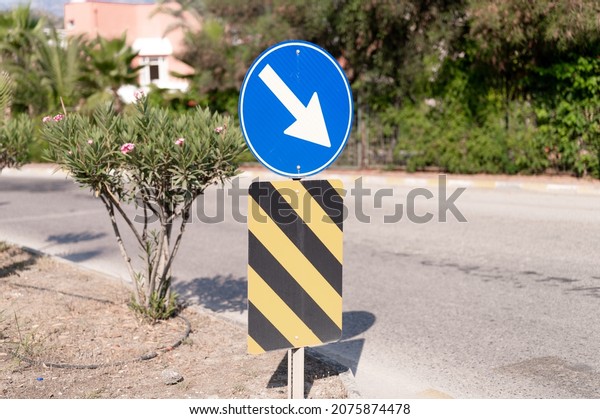 traffic\
safety signs on city street road. direction movement sign outdoor.\
danger warning symbol on urban way for transport automobile and\
car. control and regulate drive in town\
path