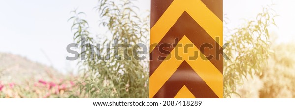 traffic safety signs on city street road. direction\
movement sign outdoor. danger warning symbol on urban way for\
transport automobile and car. control and regulate drive in town\
path. banner. flare