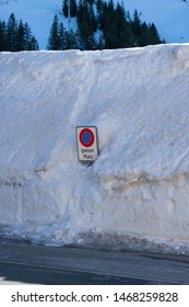 Traffic Sigh In A Big Heap Of Snow Showing The Enormous Amount Of Snow On The Road