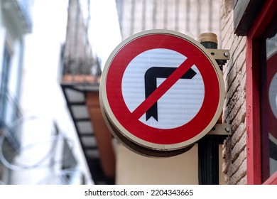 Traffic Sign Indicating And Prohibited Turning Right In Town. Road Signs Regulating Traffic On The Street. Metal Right Turn Forbidden Sign. Red Line On Black Arrow.