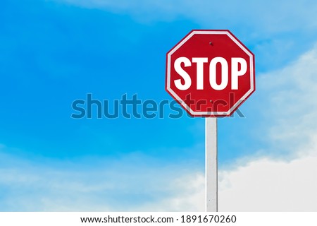 Traffic sign; Isolated ’STOP’ sign on pole with clipping paths.